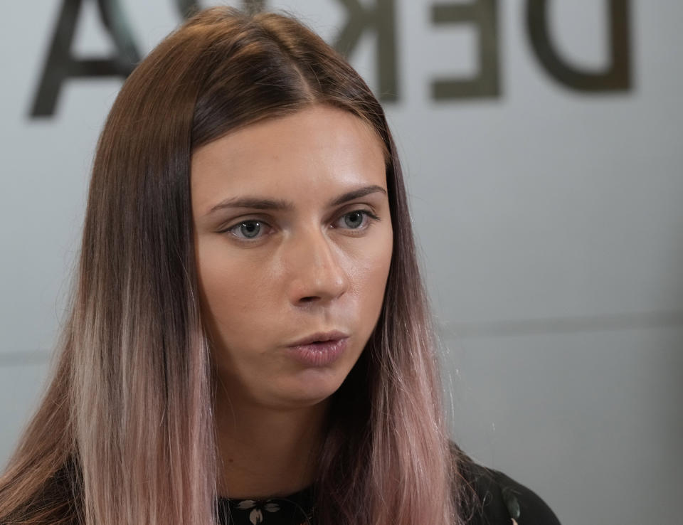 Belarusian Olympic sprinter Krystsina Tsimanouskaya, who came to Poland fearing reprisals at home after criticizing her coaches at the Tokyo Games, talks to reporters in Warsaw, Poland, Thursday, Aug. 5, 2021. (AP Photo/Czarek Sokolowski)