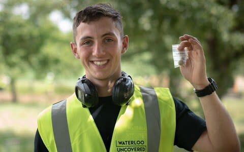 One of the Waterloo Uncovered team with a musket ball - Credit: &nbsp;Alex Cauvi