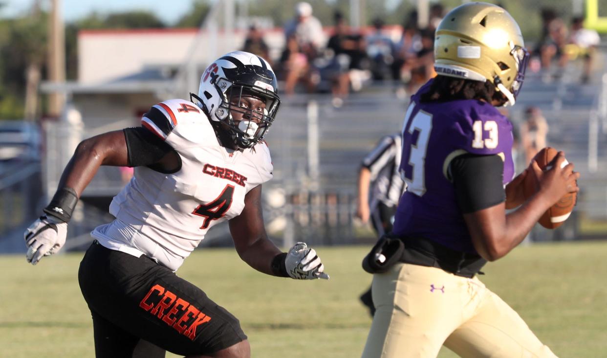 Spruce Creeks Derry Norris #4 moves on the Booker High School quarterback, Wednesday May 22, 2024 in Port Orange.