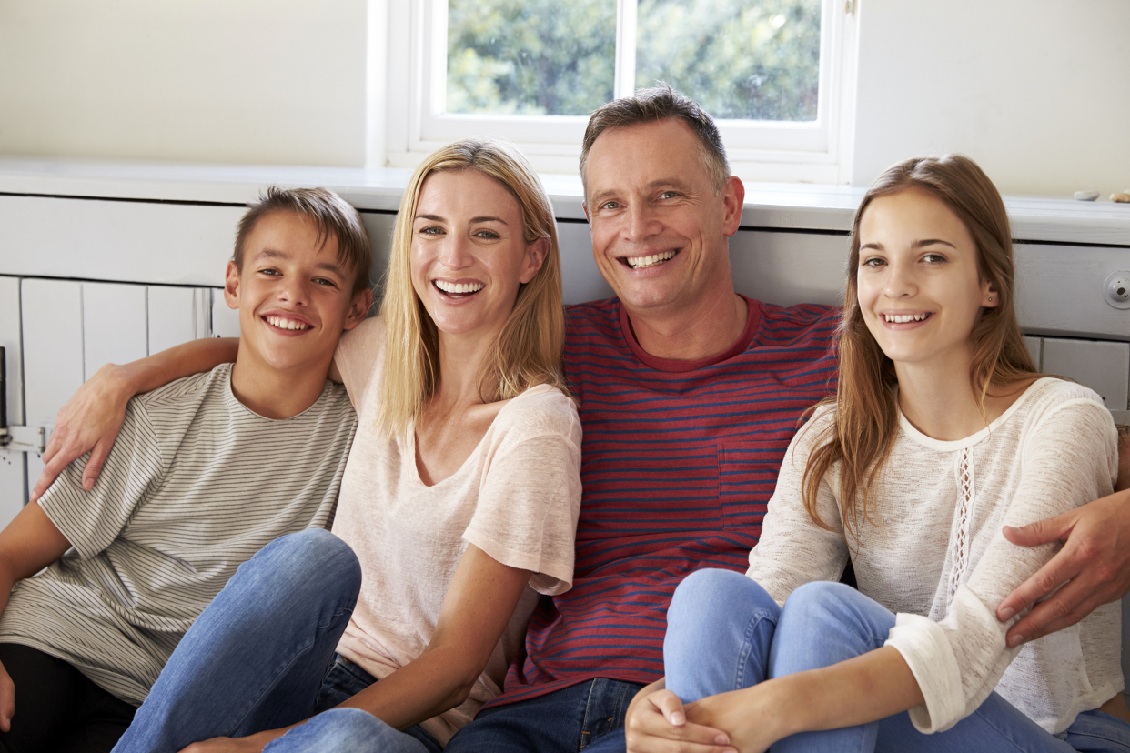 Happy family sitting together