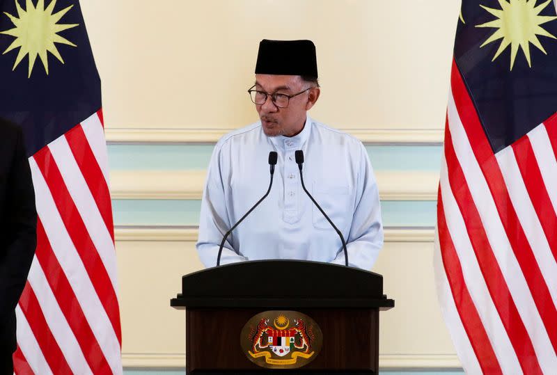 Malaysian Prime Minister Anwar Ibrahim speaks during a news conference announcing his cabinet at Putrajaya