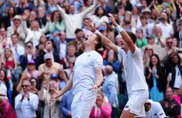 Henry Patten (right) and Harri Heliovaara celebrate while the crowd cheers