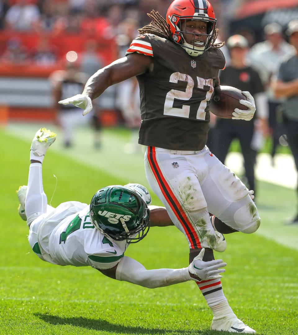 Browns running back Kareem Hunt gets away from D.J. Reed  of the Jets in the fourth quarter, Sunday, Sept. 18, 2022 in Cleveland.