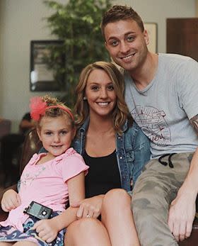 Emma Garvey poses for a family photo with her daughter Kiley and her husband. (Credit: Emma Garvey)