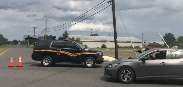 An Atlantic County Sheriff’s vehicle blocks North West Boulevard at Central Avenue due to a house fire in Buena Borough.