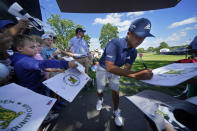 Xander Schauffele gives autographs at The Country Club, Monday, June 13, 2022, in Brookline, Mass., following a practice round ahead of the U.S. Open golf tournament. (AP Photo/Robert F. Bukaty)