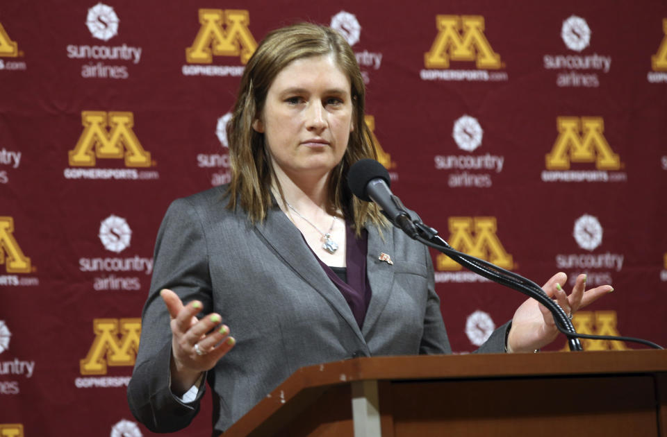 FILE - In this April 13, 2018, file photo, Lindsay Whalen addresses the media after she was introduced as Minnesota's new women's NCAA college basketball coach, in Minneapolis. The Minnesota Lynx will honor Lindsay Whalen with a ceremony this season to mark the first jersey retirement by the 20-year-old franchise. The Lynx announced Thursday, April 18, 2019, they will hang Whalen’s number 13 from the Target Center rafters, at their June 8 game against the rival Los Angeles Sparks. (AP Photo/Jim Mone, File)