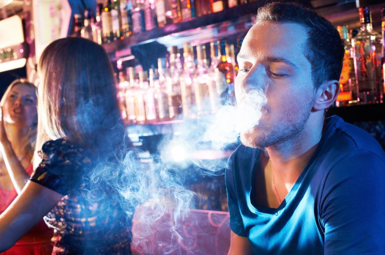 <span class="caption">How smoke moves inside a bar or outside in fresh air can help in visualizing how the coronavirus spreads.</span> <span class="attribution"><a class="link " href="https://www.gettyimages.com/detail/photo/smoking-hookah-royalty-free-image/177496759" rel="nofollow noopener" target="_blank" data-ylk="slk:Shironosova/Getty Images Plus;elm:context_link;itc:0;sec:content-canvas">Shironosova/Getty Images Plus</a></span>