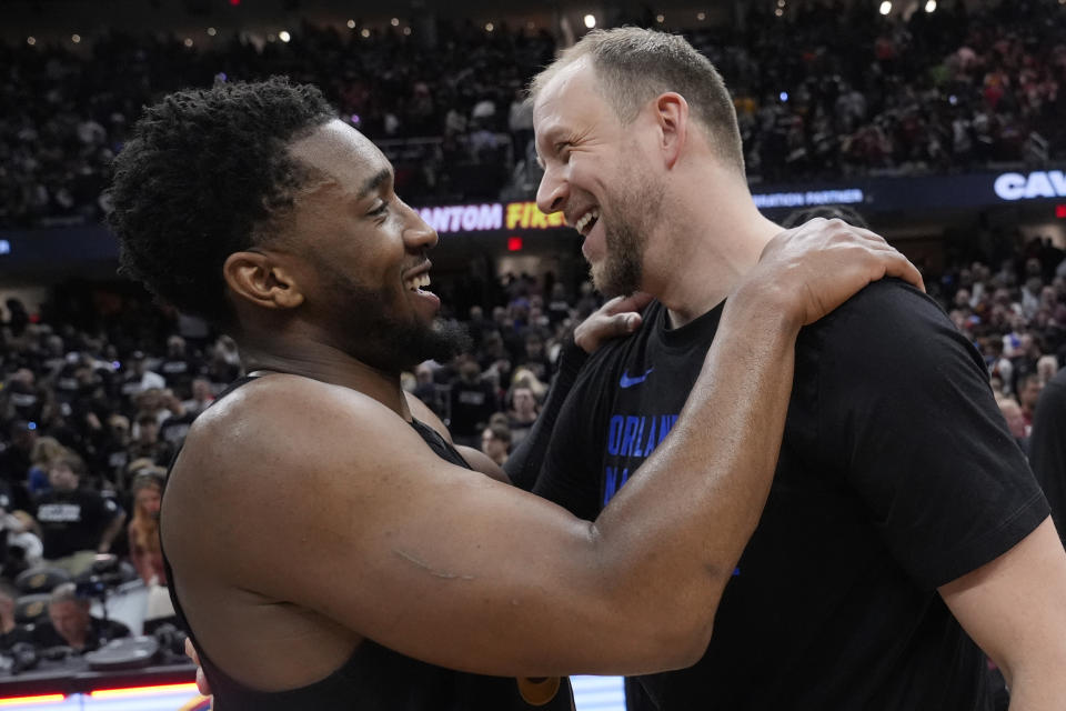 Cleveland Cavaliers' Donovan Mitchell, left, and Orlando Magic's Joe Ingles, right, talk after they defeated the Orlando Magic in Game 7 of an NBA basketball first-round playoff series Sunday, May 5, 2024, in Cleveland. (AP Photo/Sue Ogrocki)