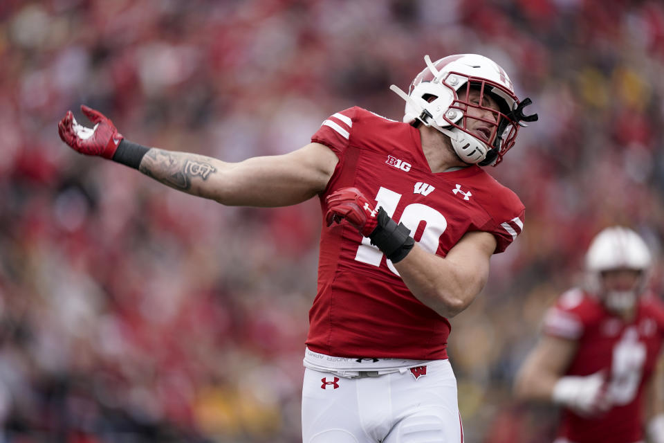 Wisconsin linebacker Nick Herbig (19) celebrates after forcing a fumble against Iowa that Wisconsin recovered during the first half of an NCAA college football game Saturday, Oct. 30, 2021, in Madison, Wis. (AP Photo/Andy Manis)