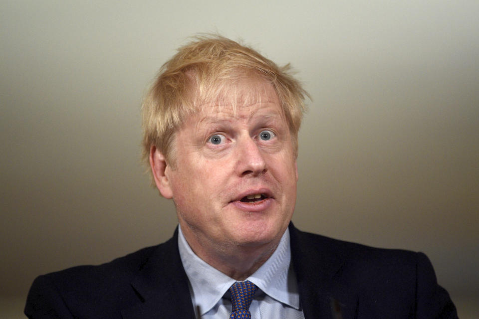 Britain's Prime Minister Boris Johnson speaks, during a coronavirus media briefing in Downing Street, London, Tuesday, Oct. 20, 2020. British Prime Minister Boris Johnson says he is imposing the highest level of coronavirus restrictions on the Greater Manchester region, after days-long negotiations between his government and local leaders who reject the measures broke down with no deal reached. (Leon Neal/Pool Photo via AP)