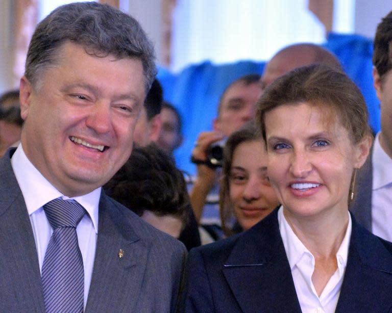 Ukraine's now president Petro Poroshenko and his wife Marina, vote in presidential elections on May 25, 2014 in Kiev