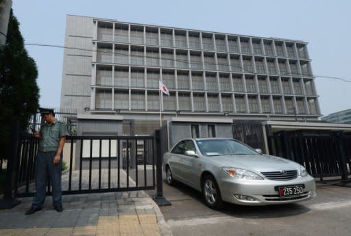 A vehicle leaves the Japanese embassy in Beijing on August 28. Japan's foreign minister Tuesday said it was time to address relations with China which have soured over a territorial dispute as an incident targeting the Japanese ambassador added to tensions