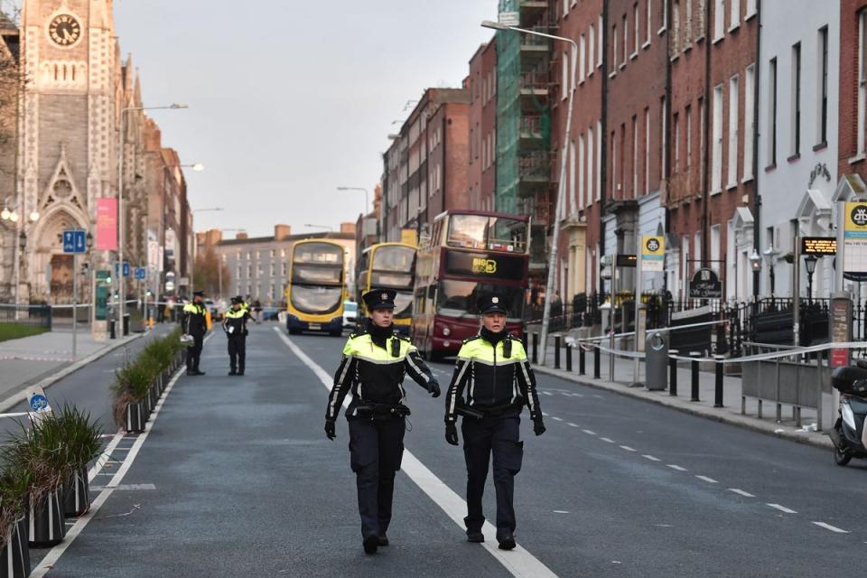 Police officers walk near the crime scene of the school stabbings in Dublin (Getty Images)