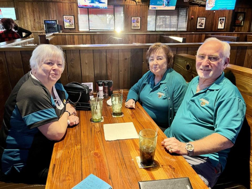 Roberta Marazo (left) and Dennis and Anne Haddock (right) were headed for their bowling league earlier week dressed in Jaguars clothing.