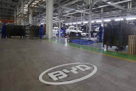 A logo of BYD is painted inside an assembly line of the automobile maker in Shenzhen, China May 25, 2016. REUTERS/Bobby Yip