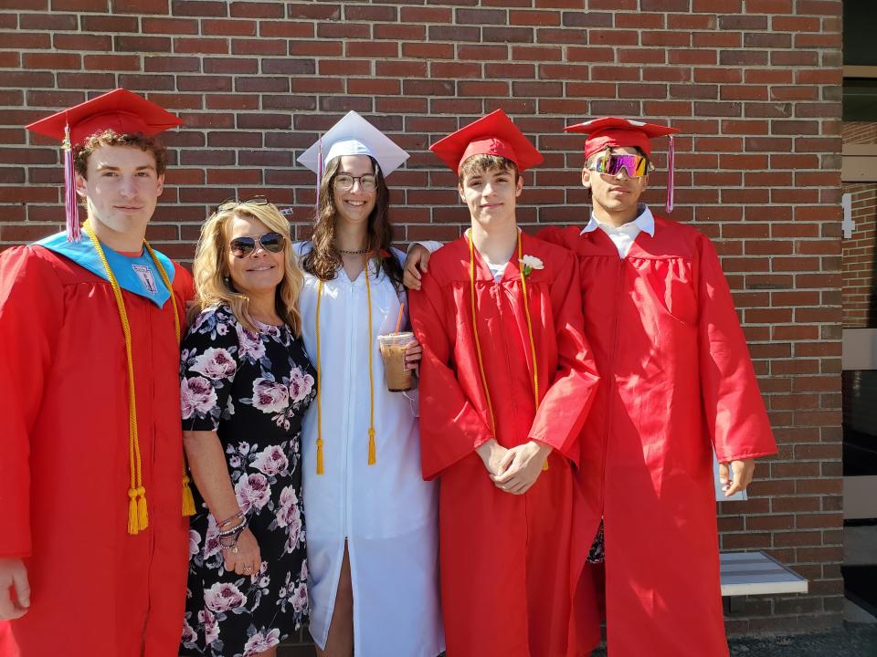 Brady Fox, left to right,  Principal Eileen Sheehy, Lauren Dunham, Michael Ducharme, and Robey Rose ham it up at Wells High School graduation on Sunday, June 5