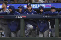 Injured Los Angeles Dodgers pitcher Clayton Kershaw, middle, stands in the dugout with teammates during the second inning of Game 2 of a baseball National League Division Series against the San Francisco Giants Saturday, Oct. 9, 2021, in San Francisco. (AP Photo/Jed Jacobsohn)