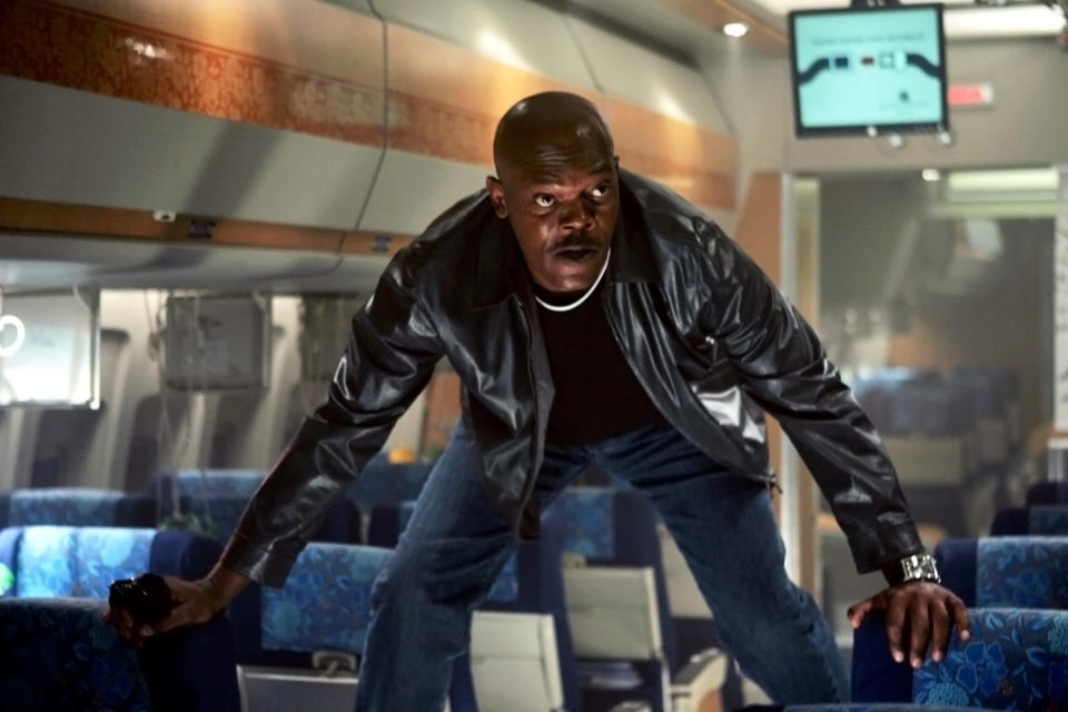 Jackson's character standing on the plane's seats