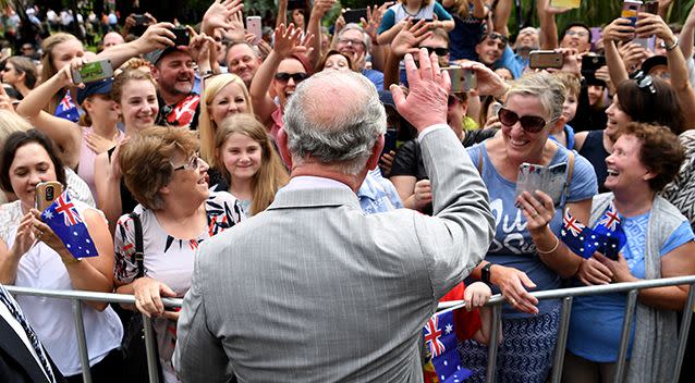 Prince Charles waves to cheering members of the public during a visit to Brisbane on Wednesday. Source: AAP