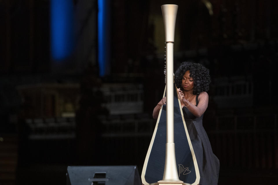 Harpist Brandee Younger performs during the Celebration of the Life of Toni Morrison, Thursday, Nov. 21, 2019, at the Cathedral of St. John the Divine in New York. (AP Photo/Mary Altaffer)
