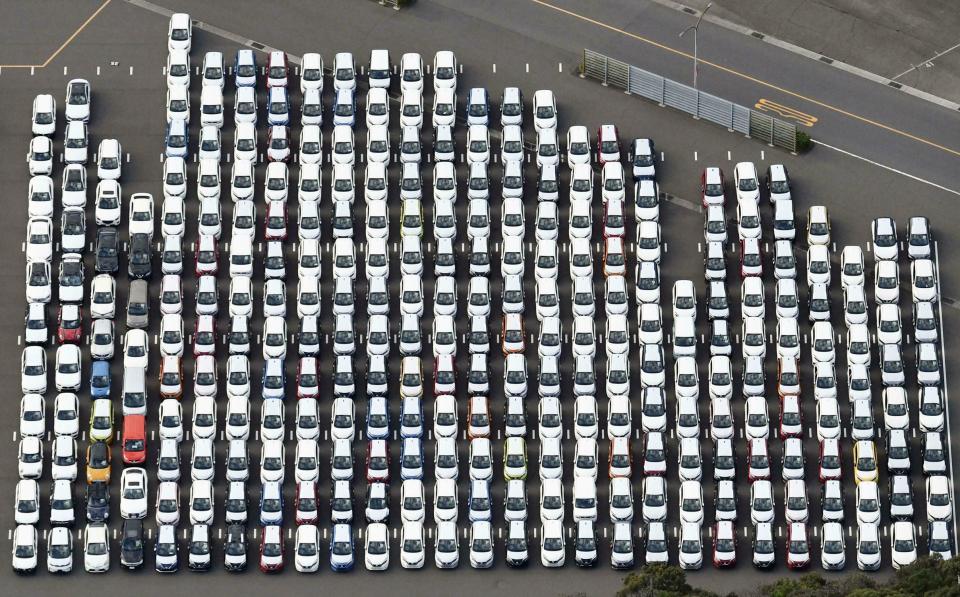 FILE - In this Nov. 20, 2018, file photo, Nissan Motor cars are seen at the automaker's Oppama plant, in Yokosuka, near Tokyo. Japanese automaker Nissan wasn’t consulted about a proposed merger between its French alliance partner Renault and Fiat Chrysler and has little say over the issue. Partnering with a colossal Renault-Fiat Chrysler could help Nissan slash costs on shared components and research. (Kyodo News via AP, File)