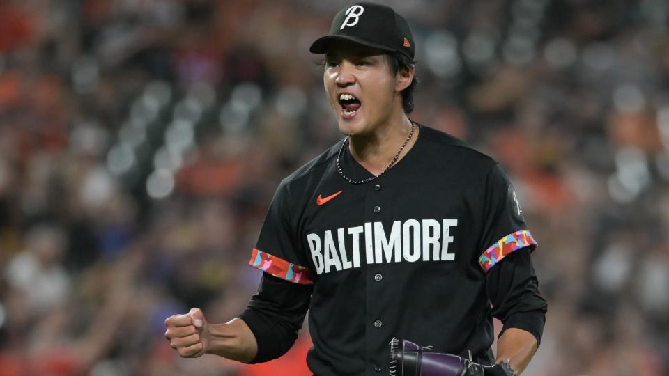 Baltimore Orioles relief pitcher Shintaro Fujinami (14) reacts after the final out of the eighth inning against the Colorado Rockies at Oriole Park at Camden Yards