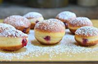 <p>Sufganiyot, better known as jelly doughnuts, come in a close second to latkes in the Hanukkah food canon. You can always buy them at <a href="https://www.thedailymeal.com/eat/best-doughnuts-every-state-slideshow?referrer=yahoo&category=beauty_food&include_utm=1&utm_medium=referral&utm_source=yahoo&utm_campaign=feed" rel="nofollow noopener" target="_blank" data-ylk="slk:your best local doughnut shop" class="link rapid-noclick-resp">your best local doughnut shop</a>, but if you feel truly festive and ambitious, you can make them at home too.</p> <p><a href="https://www.thedailymeal.com/best-recipes/sufganiyot-recipe?referrer=yahoo&category=beauty_food&include_utm=1&utm_medium=referral&utm_source=yahoo&utm_campaign=feed" rel="nofollow noopener" target="_blank" data-ylk="slk:For the Sufganiyot recipe, click here." class="link rapid-noclick-resp">For the Sufganiyot recipe, click here.</a></p>