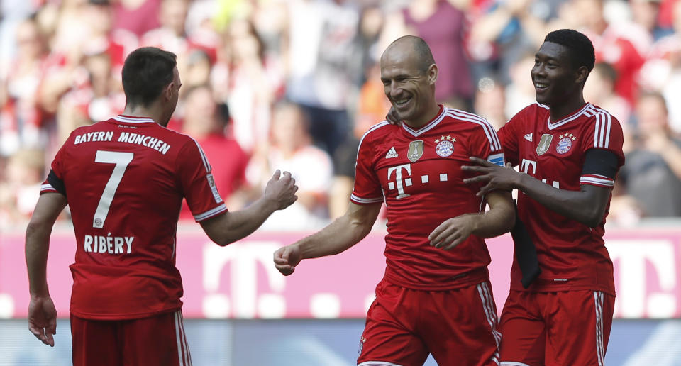 Bayern's Arjen Robben of the Netherlands, center, celebrates with team mates Franck Ribery of France, left, and David Alaba of Austria after scoring his side's fifth goal during the German first division Bundesliga soccer match between FC Bayern Munich and SV Werder Bremen, in Munich, southern Germany, Saturday, April 26, 2014. (AP Photo/Matthias Schrader)
