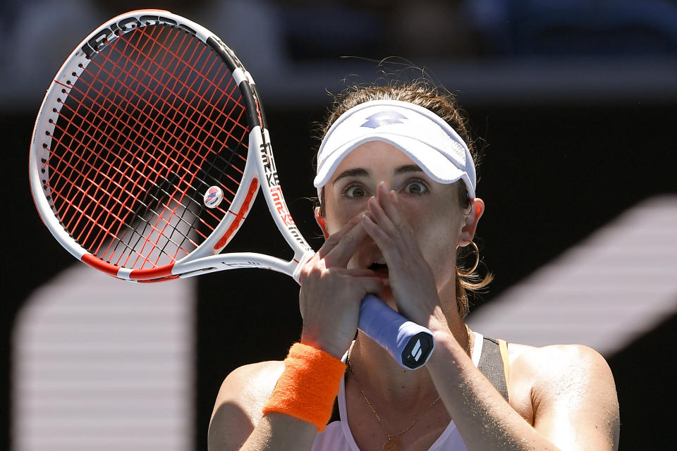 Alize Cornet of France reacts after defeating Tamara Zidansek of Slovenia in their third round match at the Australian Open tennis championships in Melbourne, Australia, Saturday, Jan. 22, 2022. (AP Photo/Andy Brownbill)