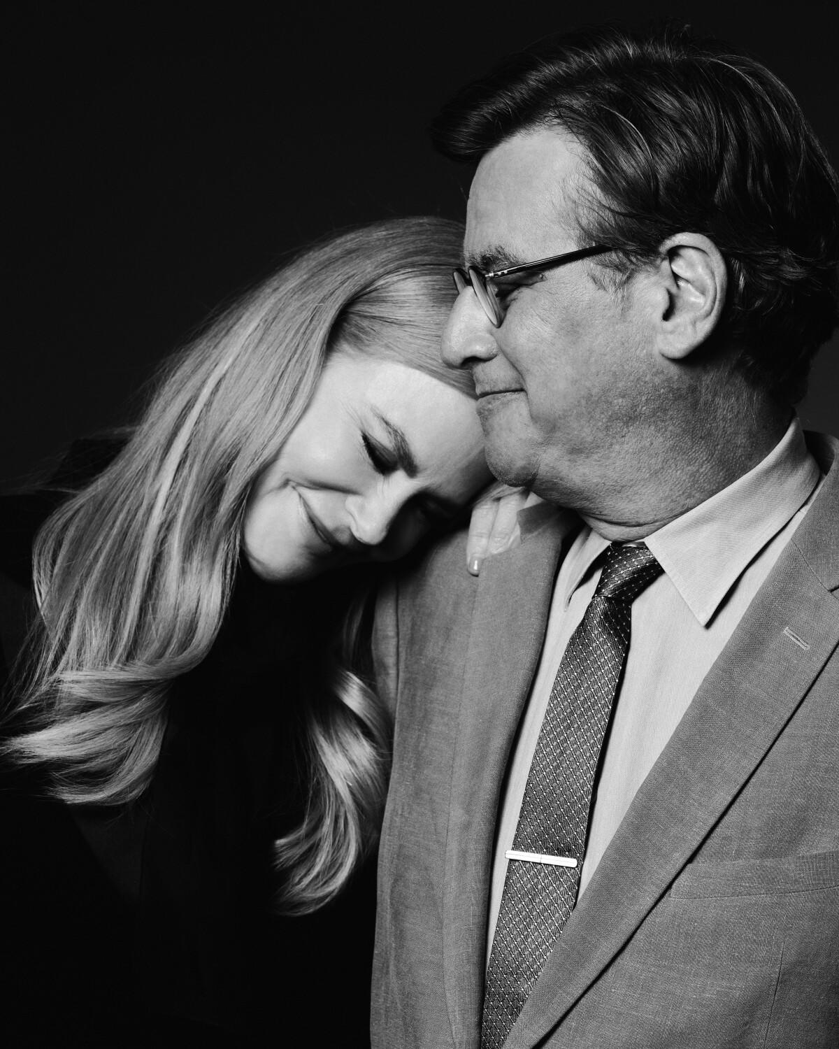 Actress Nicole Kidman leans her head on writer-director Aaron Sorkin's shoulder.