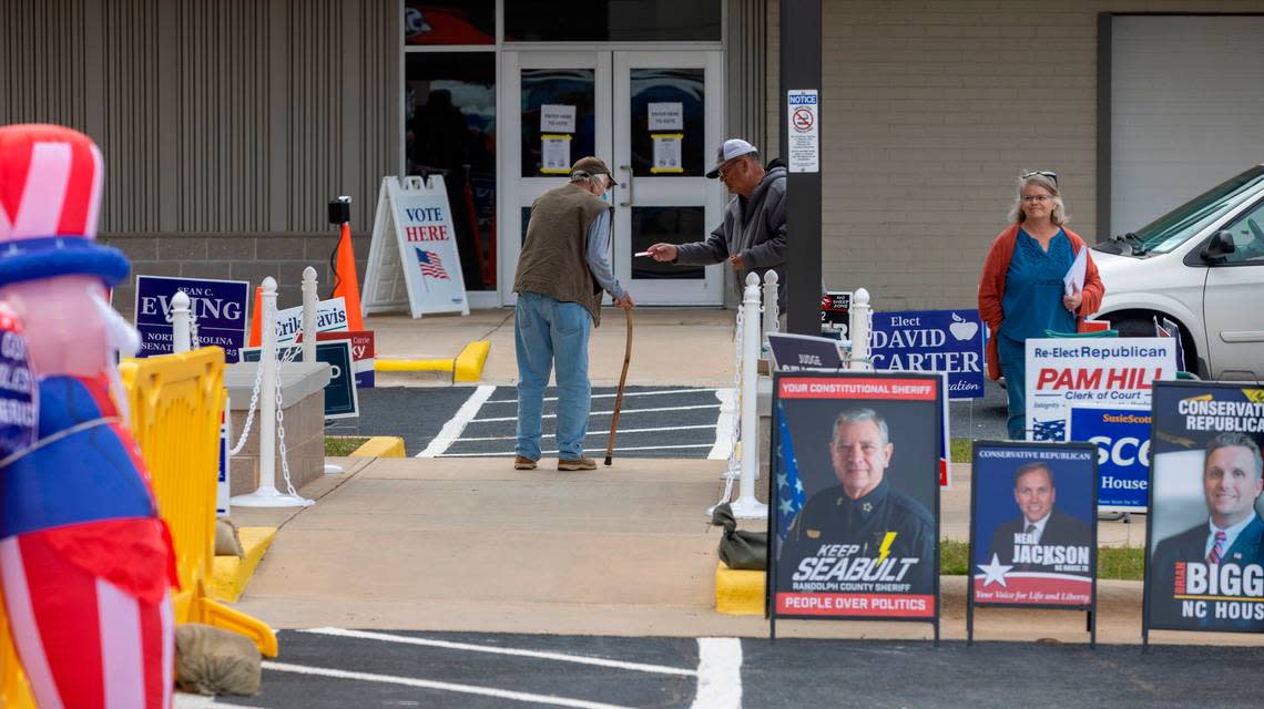 A early voter walks to the entrance of the Randolph County Board of Elections on N. Fayetteville Street to cast their ballot on Oct. 27, 2022 in Asheboro.