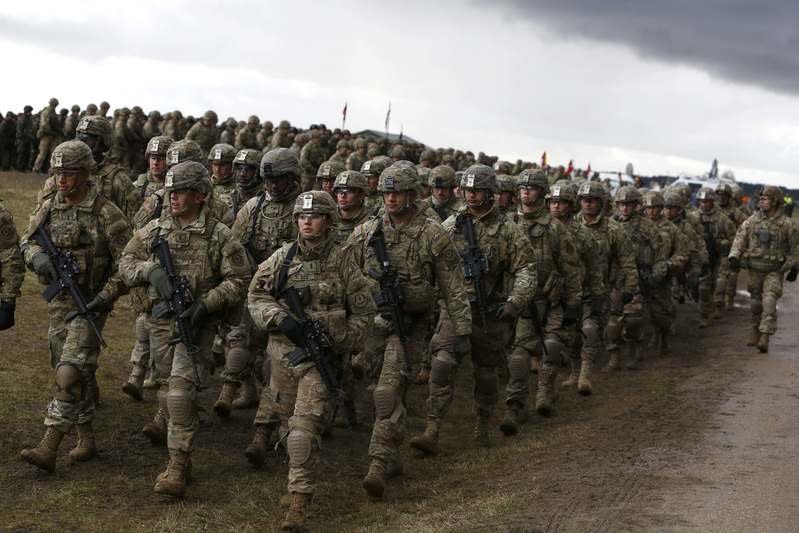 U.S. soldiers attend welcoming ceremony for U.S.-led NATO troops at polygon near Orzysz, Poland, April 13, 2017. REUTERS/Kacper Pempel