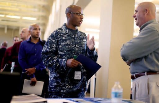 Navy Sailor E-5 Cedric Washington (L) speaks with Sim Garriotti from Lockheed Martin while interviewing for a potential position at the Opportunity Job Fair on September 6 in San Diego, California. A glum US jobs market report for August on Friday was bad news for President Obama's reelection fight but raised the likelihood that the Federal Reserve will take fresh action to boost the economy