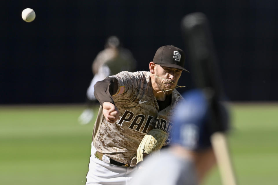 San Diego Padres starting pitcher Joe Musgrove throws to a Los Angeles Dodgers batter during the first inning of a baseball game in San Diego, Sunday, May 7, 2023. (AP Photo/Alex Gallardo)