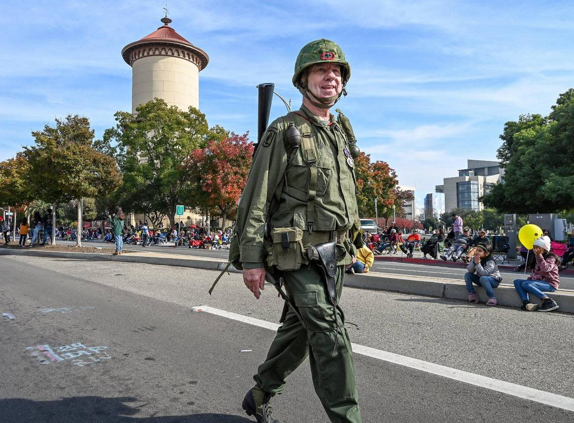 Army veteran Keith Hiler of Clovis marches in his military uniform near the Fresno Water Tower during the annual Veterans Parade in downtown Fresno on Friday, Nov. 11, 2022. CRAIG KOHLRUSS/ckohlruss@fresnobee.com