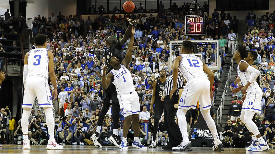 Tacko Fall tips off the ball against Zion Williamson. (Photo by Kevin C. Cox/Getty Images)