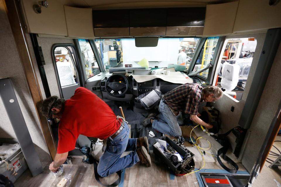 John Haugen of Thompson, Iowa (left), and Larry Schuchhardt of Hayfield, Iowa, help build out the interior of a Winnebago Via Wednesday, Nov. 16, 2016, at the Winnebago Industries manufacturing plant in Forest City, Iowa.