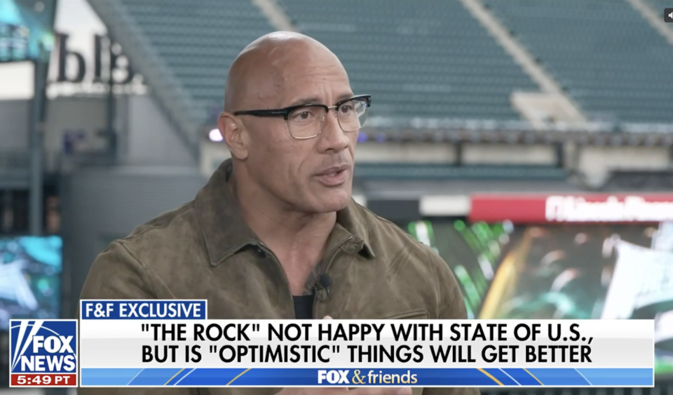 Dwayne "The Rock" Johnson during a TV interview, with a caption about his views on the state of the U.S