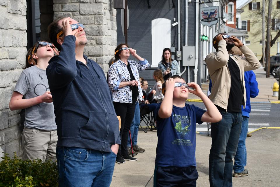 Dozens of residents came out to the Matthews Public Library Monday afternoon to see the total solar eclipse in Fredericksburg, Pa.