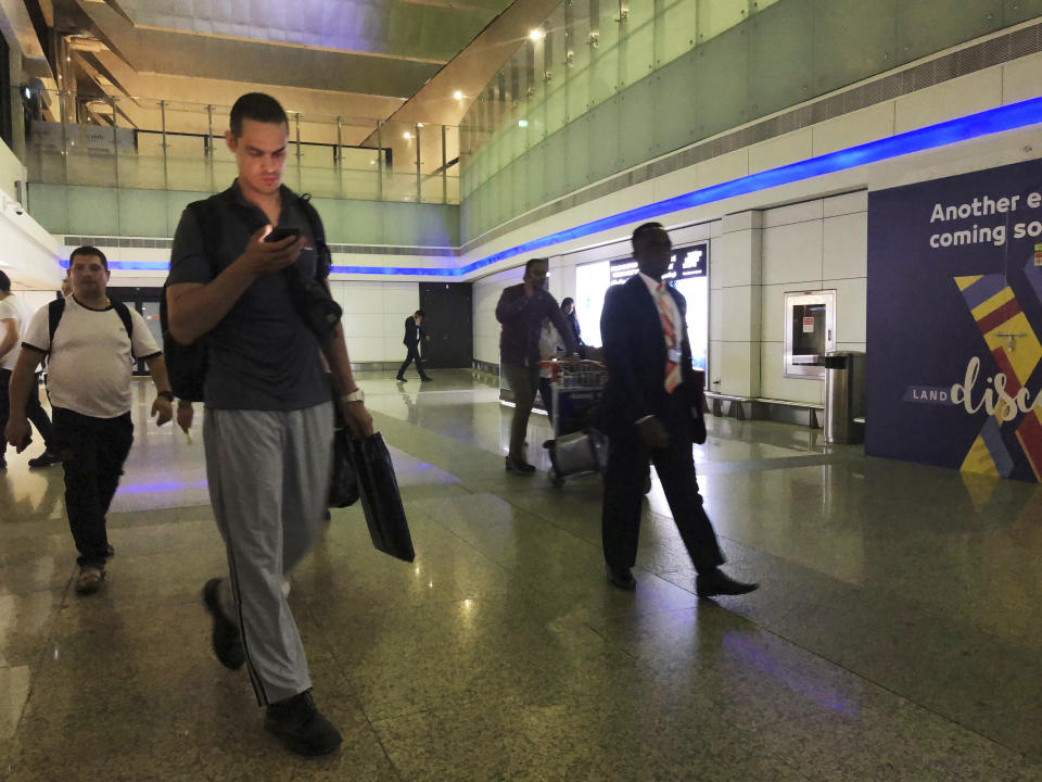 Mariners from the MT Front Altair arrive at Dubai International Airport in Dubai, United Arab Emirates, on Saturday, June 15, 2019, after spending two days in Iran. Associated Press journalists saw the crew members of the MT Front Altair on Saturday night after their Iran Air flight from Bandar Abbas, Iran, landed in Dubai in the United Arab Emirates. The Norwegian-owned oil tanker was attacked Thursday, June 13, in the Gulf of Oman. The U.S. has accused Iran of attacking the Front Altair and another oil tanker with limpet mines. Iran has denied the allegations. (AP Photo/Jon Gambrell)