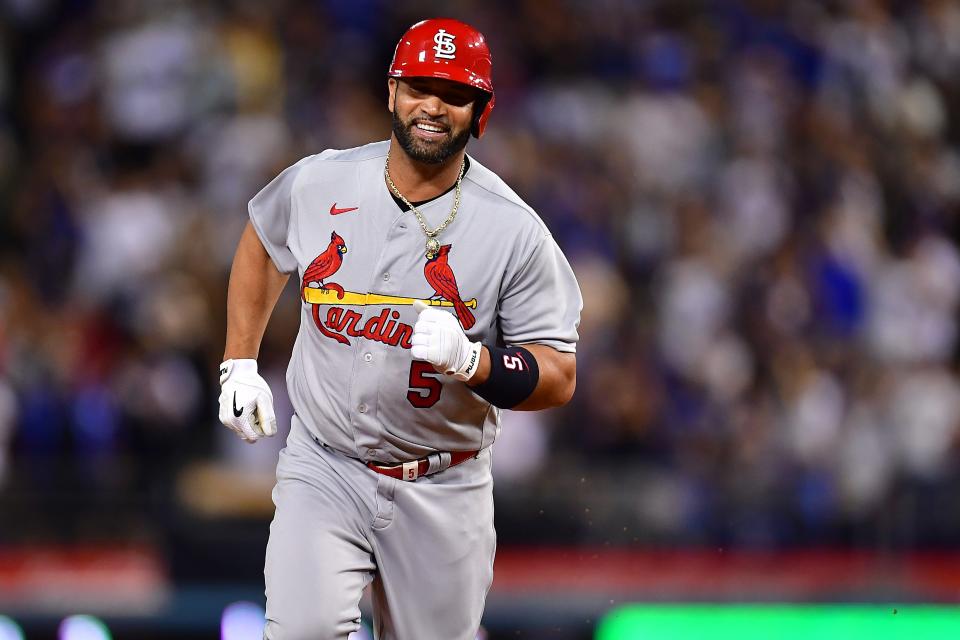 Cardinals designated hitter Albert  Pujols rounds the bases after hitting his 700th home run against the Dodgers last Friday.