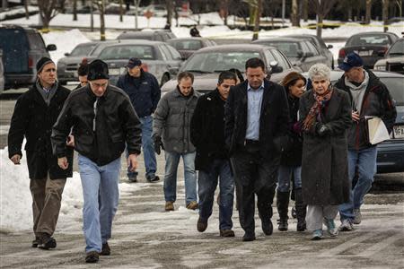 Howard County officials walk to deliver remarks after a shooting at a shopping mall in Columbia, Maryland January 25, 2014. REUTERS/James Lawler Duggan