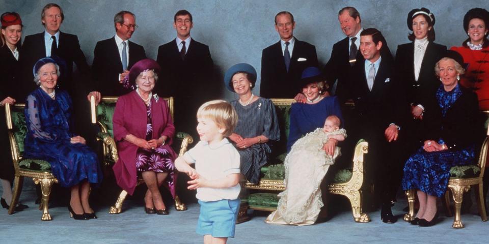 <p>A young Prince William makes the royal family laugh as they pose for photos at Prince Harry's christening. </p>