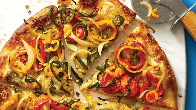 a pizza with onions and peppers