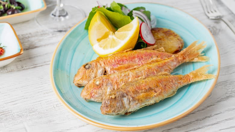Cooked red mullet on plate
