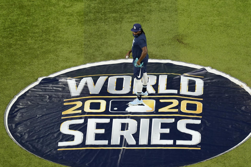 Tampa Bay Rays relief pitcher Diego Castillo (63) stands on the pitcher's mound at Globe Life Field as the team prepares for the baseball World Series against the Los Angeles Dodgers, in Arlington, Texas, Monday day, Oct. 19, 2020, 2020. (AP Photo/Eric Gay)