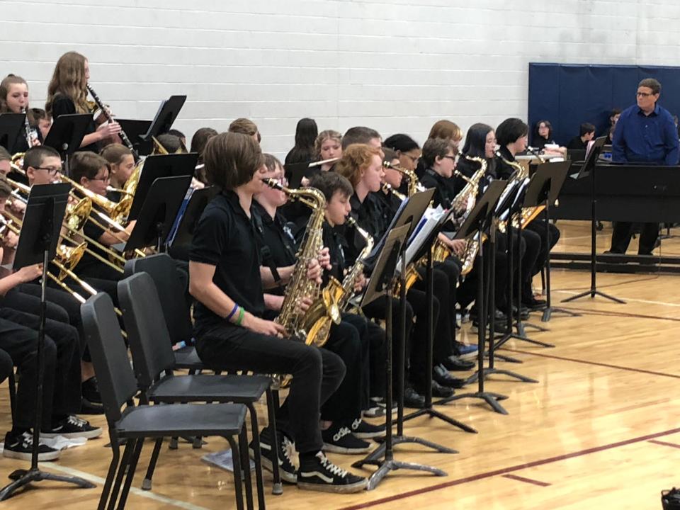 Diane Wightman (right) performs with the Liberty Middle School stage band last week, during her final concert for Newark City Schools.