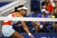 Emma Raducanu, of Britain, misses a shot to Alize Cornet, of France, during the first round of the US Open tennis championships, Tuesday, Aug. 30, 2022, in New York. (AP Photo/Frank Franklin II)