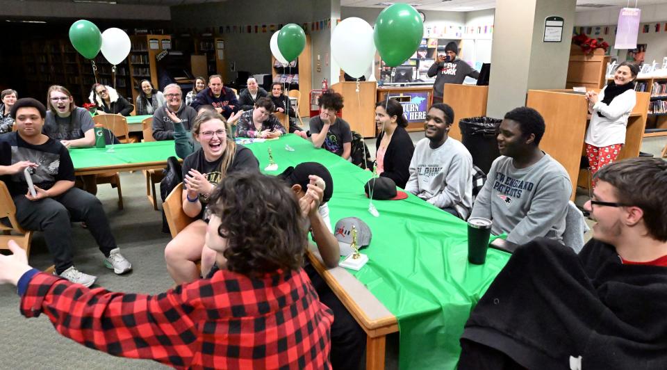 Dennis-Yarmouth Unified Sports players and partners crack up during a moment at their awards banquet in the school library on Dec. 13.